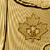 laser-etched engraving on gold maple coin