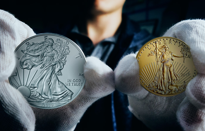 Gold and Silver Eagle Comparison In Hand